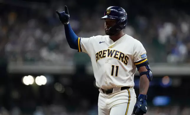 Milwaukee Brewers' Jackson Chourio gestures after hitting an RBI single during the fifth inning of a baseball game against the Seattle Mariners, Tuesday, Aug. 18, 2026, in Milwaukee. (AP Photo/Aaron Gash)