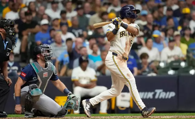 Milwaukee Brewers' David Hamilton hits a three-run home run during the sixth inning of a baseball game against the Seattle Mariners, Tuesday, Aug. 18, 2026, in Milwaukee. (AP Photo/Aaron Gash)
