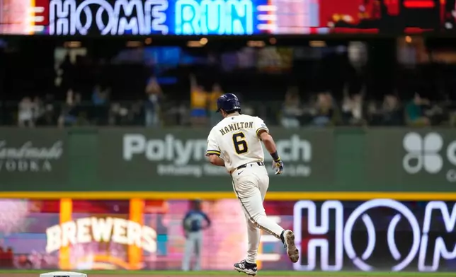 Milwaukee Brewers' David Hamilton rounds the bases after hitting a three-run home run during the sixth inning of a baseball game against the Seattle Mariners, Tuesday, Aug. 18, 2026, in Milwaukee. (AP Photo/Aaron Gash)