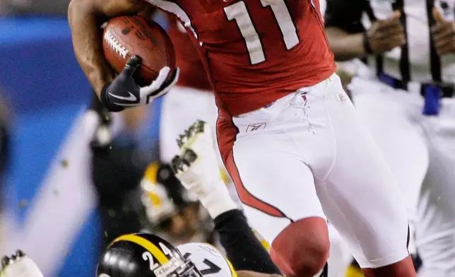 FILE - Arizona Cardinals wide receiver Larry Fitzgerald (11) runs past Pittsburgh Steelers cornerback Ike Taylor (24) for a 64-yard touchdown reception during the fourth quarter of the NFL Super Bowl XLIII football game, Feb. 1, 2009, in Tampa, Fla. (AP Photo/Mark Humphrey, File)
