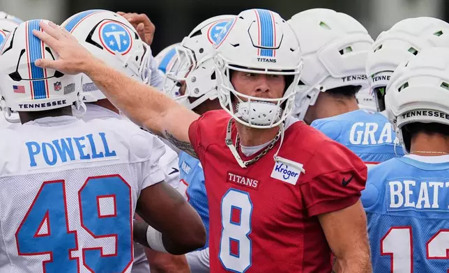 Tennessee Titans quarterback Will Levis (8) huddles with teammates during the NFL football team's training camp Saturday, Aug. 1, 2026, in Nashville, Tenn. (AP Photo/George Walker IV)