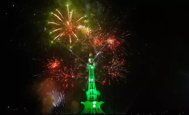 Fireworks light the sky over the Minar-e-Pakistan monument marking Independence Day in Lahore, Pakistan, Friday, Aug. 14, 2026. (AP Photo/K.M. Chaudary)