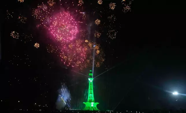 Fireworks light the sky over the Minar-e-Pakistan monument marking Independence Day in Lahore, Pakistan, Friday, Aug. 14, 2026. (AP Photo/K.M. Chaudary)