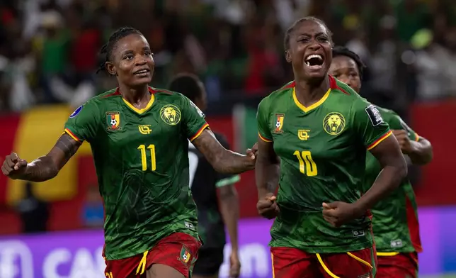 Cameroon's Naomi Leslie Ndjoah Eto, right, celebrates after scoring her team's second goal against Malawi during the Women AFCON 2026 final soccer match, in Rabat, Morocco, Sunday, Aug. 16, 2026. (AP Photo)