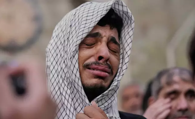 A Irani Shiite Muslim weeps as he prays inside the holy shrine of Imam Abbas ahead of the Arbaeen festival in Karbala, Iraq, Sunday, Aug. 2, 2026. (AP Photo/Hadi Mizban)