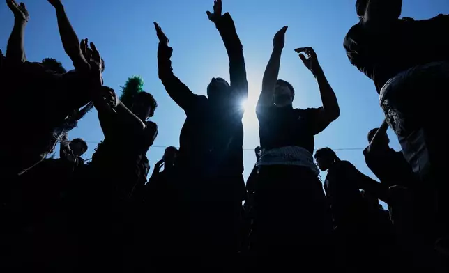 Shiite Muslim worshippers beat their chests in a ritual act of mourning as they march toward the Imam Hussein Shrine ahead of Arbaeen, the annual Shiite commemoration marking 40 days after Ashoura, in Karbala, Iraq, Monday, Aug. 3, 2026. (AP Photo/Hadi Mizban)