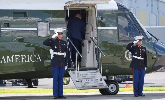 President Donald Trump boards Marine One at Morristown Municipal Airport in Morristown, N.J., Friday, July 31, 2026, from Camp David, the presidential retreat. (AP Photo/Jacquelyn Martin)