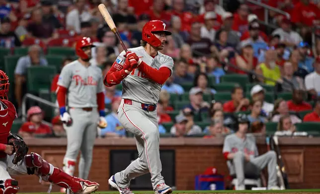 Philadelphia Phillies' Bryson Stott (5) watches his single in the fifth inning of a baseball game against the St. Louis Cardinals, Monday, Aug. 10, 2026, in St. Louis. (AP Photo/Joe Puetz)