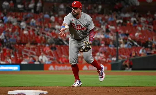 Philadelphia Phillies first baseman Kyle Schwarber throws out St. Louis Cardinals' Cesar Prieto at first base in the sixth inning of a baseball game, Monday, Aug. 10, 2026, in St. Louis. (AP Photo/Joe Puetz)
