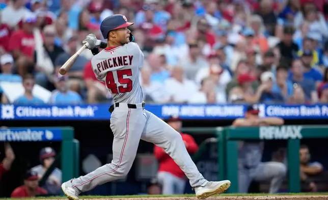Washington Nationals' Andrew Pinckney follows through after hitting a home run against Philadelphia Phillies pitcher Cristopher Sánchez during the fourth inning of a baseball game Thursday, Aug. 6, 2026, in Philadelphia. (AP Photo/Matt Slocum)