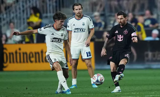 Inter Miami's Leo Messi, right, passes past Philadelphia Union's Milan Iloski, left, and Indiana Vassilev, center, during the first half of an MLS soccer match, Wednesday, Aug. 19, 2026, in Chester, Pa. (AP Photo/Matt Rourke)