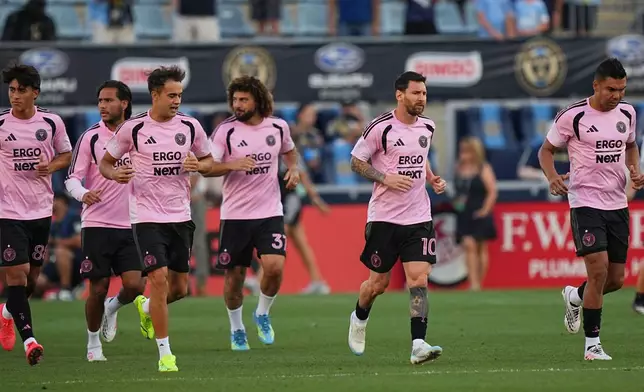 Inter Miami's Leo Messi (10) and teammates run onto the field ahead of an MLS soccer match against the Philadelphia Union, Wednesday, Aug. 19, 2026, in Chester, Pa. (AP Photo/Matt Rourke)