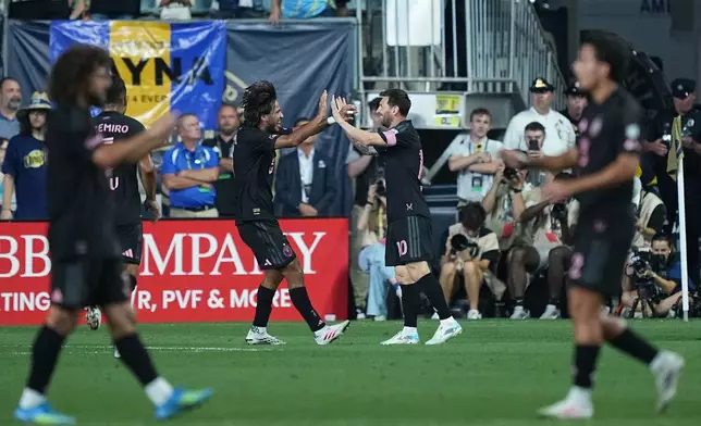 Inter Miami's Leo Messi, center right, celebrates after scoring against the Philadelphia Union during the first half of an MLS soccer match, Wednesday, Aug. 19, 2026, in Chester, Pa. (AP Photo/Matt Rourke)