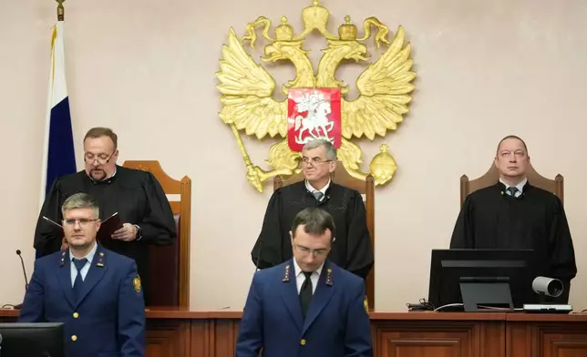 Chairman of the Appellate Board of the Supreme Court judge Vladimir Zaitsev, background center, his deputy Igor Zinchenko, and Judge Denis Tyutin, attend a reading of the court decision on an appeal against its ruling to bar the Yabloko party from the upcoming parliamentary elections, at the Russia's Supreme Court, in Moscow, Monday, Aug. 17, 2026. (AP Photo/Pavel Bednyakov)