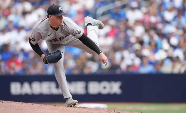 New York Yankees starting pitcher Ryan Weathers works against the Toronto Blue Jays during the first inning of a baseball game in Toronto, Sunday, Aug. 16, 2026. (Nathan Denette/The Canadian Press via AP)