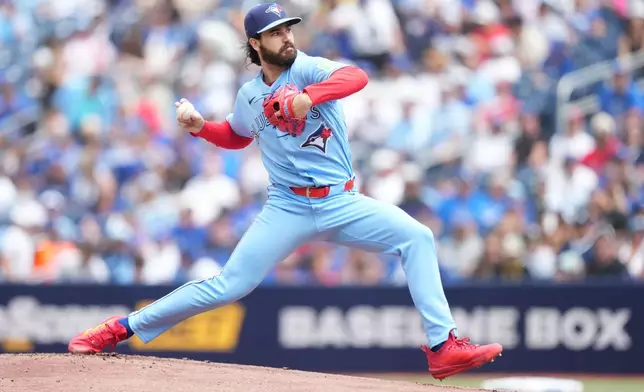 Toronto Blue Jays starting pitcher Dylan Cease works against the New York Yankees during the first inning of a baseball game in Toronto, Sunday, Aug. 16, 2026. (Nathan Denette/The Canadian Press via AP)
