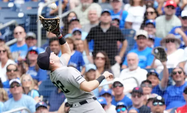 New York Yankees first baseman Ben Rice catches a pop flyout during the first inning of a baseball game against the Toronto Blue Jays in Toronto, Sunday, Aug. 16, 2026. (Nathan Denette/The Canadian Press via AP)