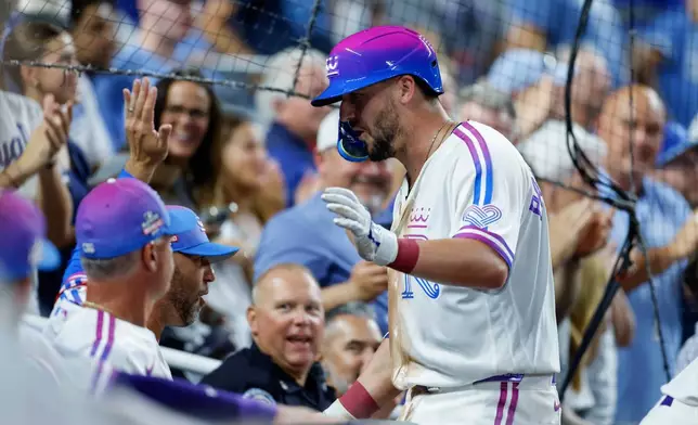 Kansas City Royals' Vinnie Pasquantino celebrates after hitting a home run during the sixth inning of a baseball game against the Detroit Tigers in Kansas City, Mo., Friday, Aug. 21, 2026. (AP Photo/Colin E. Braley)