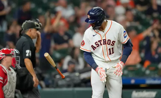 Houston Astros' Cam Smith (11) flips his bat after hitting a home run against the Los Angeles Angels during the eighth inning of a baseball game Tuesday, Aug. 18, 2026, in Houston. (AP Photo/David J. Phillip)