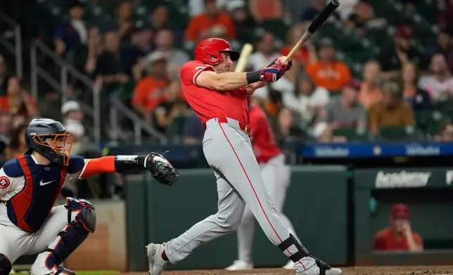 Los Angeles Angels' Josh Lowe, right, hits a home run as Houston Astros catcher Yainer Diaz reaches for the pitch during the fourth inning of a baseball game Tuesday, Aug. 18, 2026, in Houston. (AP Photo/David J. Phillip)