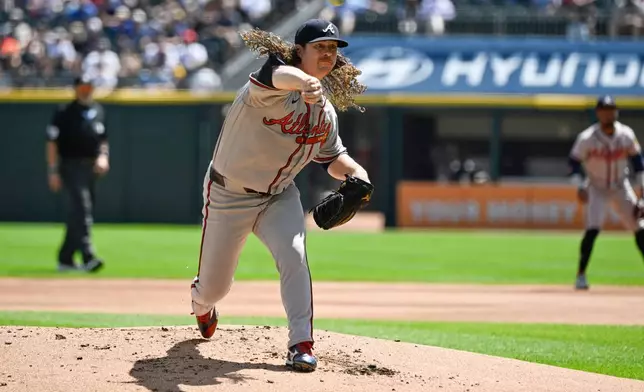 Atlanta Braves pitcher Grant Holmes delivers during the first inning of a baseball game against the Chicago White Sox, Thursday, Aug. 20, 2026, in Chicago. (AP Photo/Matt Marton)