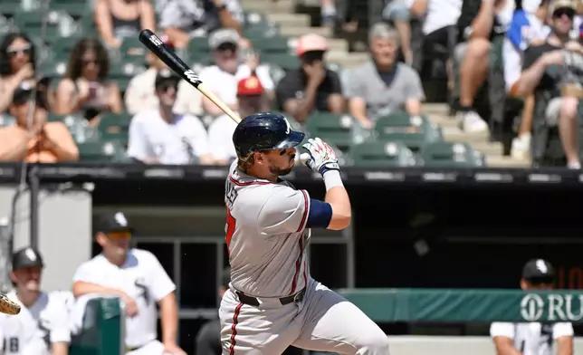 Atlanta Braves' Austin Riley hits a one-run double during the third inning of a baseball game against the Chicago White Sox, Thursday, Aug. 20, 2026, in Chicago. (AP Photo/Matt Marton)