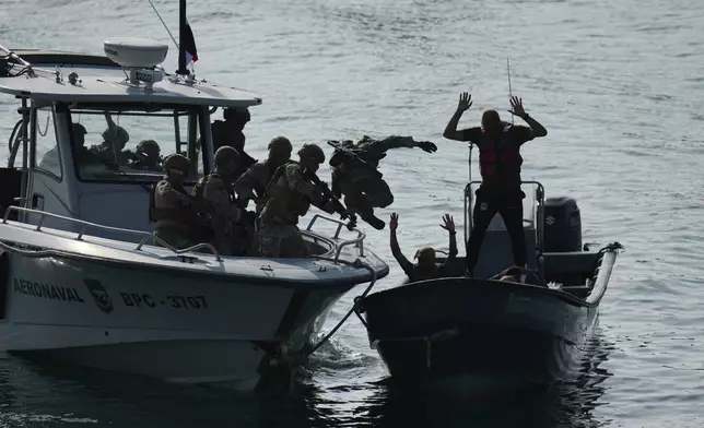 Military personnel train to board boats during a U.S.-sponsored multinational military exercise in Panama City, Thursday, Aug. 13, 2026. (AP Photo/Matias Delacroix)
