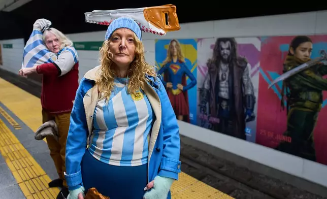 Judith Naidorf, a researcher with Argentina's National Scientific and Technical Research Council, poses for a photo while waiting to ride the subway to a protest demanding increased funding for science in Buenos Aires, Argentina, Wednesday, Aug. 12, 2026. (AP Photo/Rodrigo Abd)