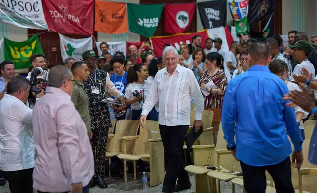 Cuba's President Miguel Díaz-Canel, center, arrives for the opening of the Continental Assembly, attended by ALBA delegates supporting Cuba and marking the centenary of the birth of Fidel Castro, in Havana, Thursday, Aug. 6, 2026. (AP Photo/Ramon Espinosa)