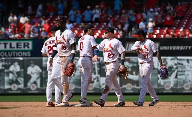 The St. Louis Cardinals celebrate after defeating the Colorado Rockies in a baseball game, Sunday, Aug. 9, 2026, in St. Louis. (AP Photo/Joe Puetz)