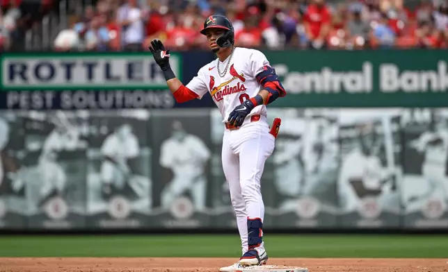 St. Louis Cardinals' Masyn Winn celebrates after hitting an RBI double in the third inning of a baseball game against the Colorado Rockies, Sunday, Aug. 9, 2026, in St. Louis. (AP Photo/Joe Puetz)
