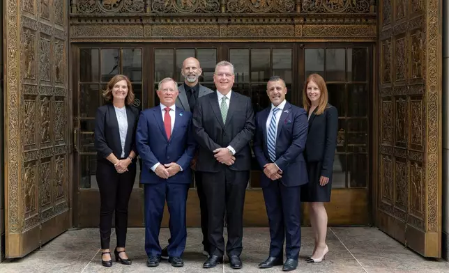 TLC Healthcare CEO & MD with Mayo Global Team officials in front of the Iconic Plummer Door Entry at Mayo Clinic Centre, Rochester Minnesota USA. Names and titles of the individuals in the photo:- • Mr Lou Pascuzzi, CEO&MD TLC Healthcare • James Hebl, M.D., Anesthesiologist, Senior Advisor, International • Terry Brandt, Senior Advisor, International (Emeritus) • April Bursiek, M.S.N., R.N., A.C.N.S.-B.C. Senior Advisor, International Nursing • Eric Short, PMP, Program Manager, International Facilities • Andrea, Cohen, M.S., M.P.A., M.B.A. Executive Director, International Advisory Services