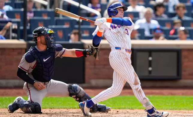 New York Mets' Carson Benge hits an RBI double during the seventh inning in the first baseball game of a doubleheader against the Atlanta Braves, Wednesday, July 29, 2026, in New York. (AP Photo/Yuki Iwamura)