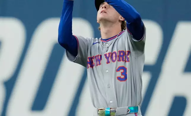 New York Mets right fielder Carson Benge (3) catches a flyout hit by Cleveland Guardians' Austin Hedges in the sixth inning of a baseball game in Cleveland, Tuesday, Aug. 4, 2026. (AP Photo/Sue Ogrocki)
