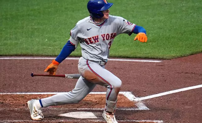 New York Mets' Carson Benge singles off Pittsburgh Pirates pitcher Carmen Mlodzinski, driving in a run, during the third inning of a baseball game in Pittsburgh, Friday, Aug. 7, 2026. (AP Photo/Gene J. Puskar)