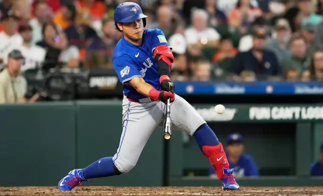 Toronto Blue Jays' Kazuma Okamoto singles during the sixth inning of a baseball game against the Houston Astros in Houston, Wednesday, Aug. 5, 2026. (AP Photo/Ashley Landis)
