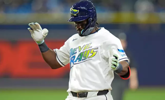 Tampa Bay Rays' Jorge Mateo celebrates his single off San Diego Padres pitcher Griffin Canning during the seventh inning of a baseball game Friday, Aug. 28, 2026, in St. Petersburg, Fla. (AP Photo/Chris O'Meara)