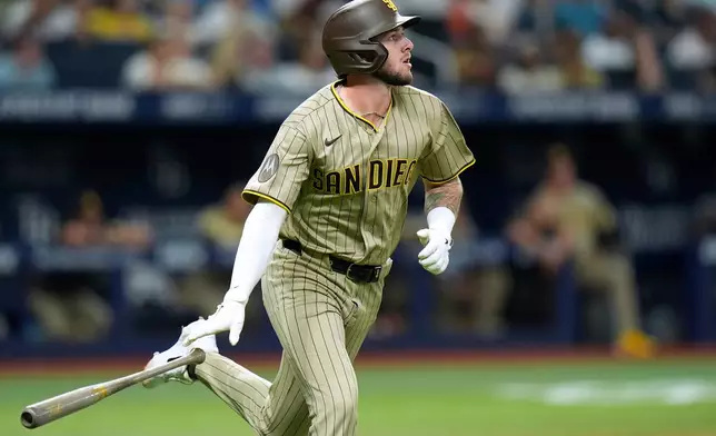 San Diego Padres' Jackson Merrill watches his two-run home run off Tampa Bay Rays pitcher Shane McClanahan during the sixth inning of a baseball game Friday, Aug. 28, 2026, in St. Petersburg, Fla. (AP Photo/Chris O'Meara)