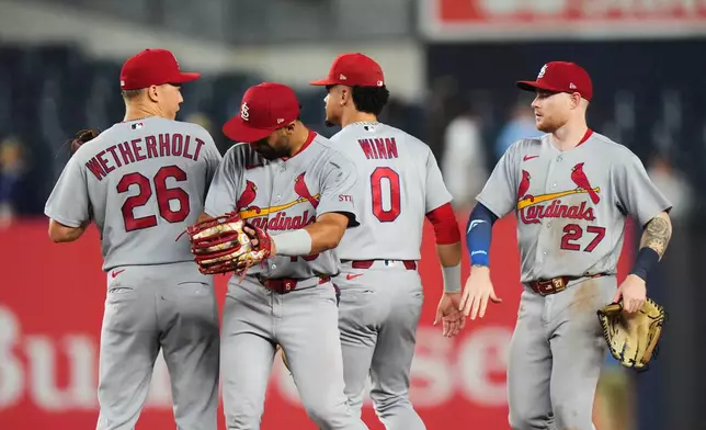St. Louis Cardinals' José Fermín celebrates with JJ Wetherholt (26), Masyn Winn (0) and Nathan Church (27) after a baseball game against the New York Yankees Wednesday, Aug. 5, 2026, in New York. (AP Photo/Frank Franklin II)