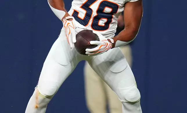 Denver Broncos running back Jaleel McLaughlin celebrates after scoring a touchdown during the first half of a preseason NFL football game against the Minnesota Vikings, Friday, Aug. 28, 2026, in Denver. (AP Photo/Jack Dempsey)