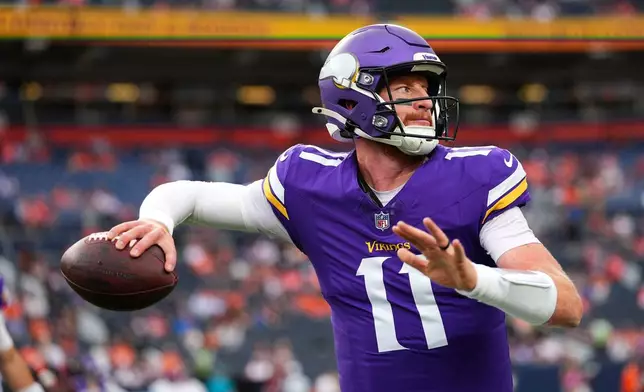 Minnesota Vikings quarterback Carson Wentz warms up before a preseason NFL football game against the Denver Broncos, Friday, Aug. 28, 2026, in Denver. (AP Photo/Jack Dempsey)
