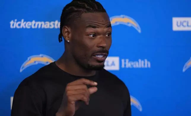 Los Angeles Chargers safety Derwin James Jr. gestures at a news conference during an NFL football training camp Tuesday, Aug. 4, 2026, in San Diego. (AP Photo/Gregory Bull)