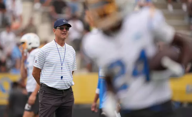 Los Angeles Chargers head coach Jim Harbaugh during an NFL football training camp Tuesday, Aug. 4, 2026, in San Diego. (AP Photo/Gregory Bull)