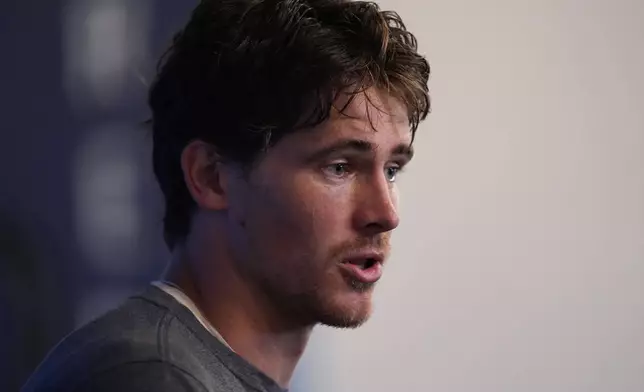 Los Angeles Chargers quarterback Justin Herbert speaks at a news conference during an NFL football training camp Tuesday, Aug. 4, 2026, in San Diego. (AP Photo/Gregory Bull)