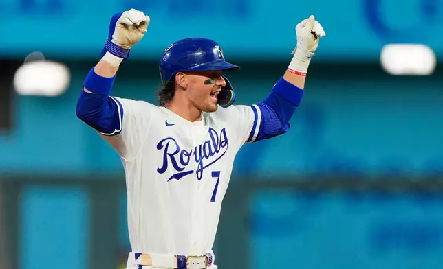 Kansas City Royals' Bobby Witt Jr. celebrates on second after hitting a double during the sixth inning of a baseball game against the Minnesota Twins, Thursday, Aug. 6, 2026, in Kansas City, Mo. (AP Photo/Charlie Riedel)
