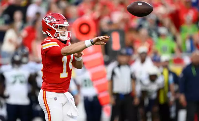 Kansas City Chiefs quarterback Garrett Nussmeier (14) throws against the Seattle Seahawks during the first half of a preseason NFL football game, Friday, Aug. 28, 2026, in Kansas City, Mo. (AP Photo/Reed Hoffmann)