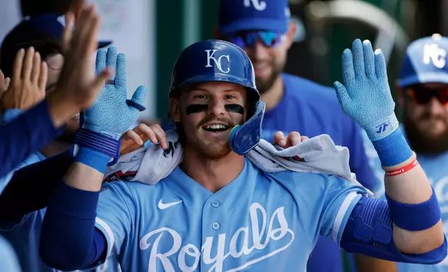 Kansas City Royals' Bobby Witt Jr. celebrates in the dugout after hitting a home run during the first inning of a baseball game against the Athletics in Kansas City, Mo., Thursday, Aug. 20, 2026. (AP Photo/Colin E. Braley)