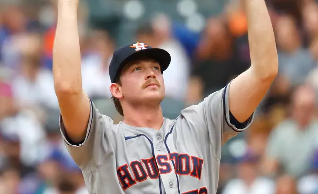 Houston Astros' Ethan Pecko pauses before pitching against the New York Mets during the first inning of a baseball game, Sunday, Aug. 30, 2026, in New York. (AP Photo/Noah K. Murray)