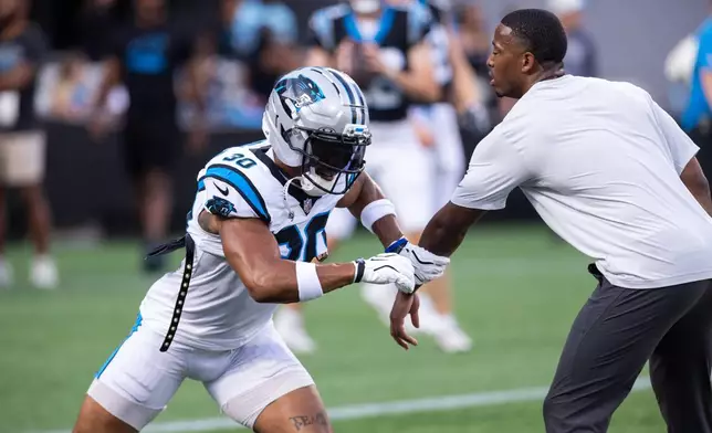 Carolina Panthers running back Chuba Hubbard (30) runs a route during the NFL football team's fan fest Friday, July 31, 2026, in Charlotte, N.C. (AP Photo/Scott Kinser)