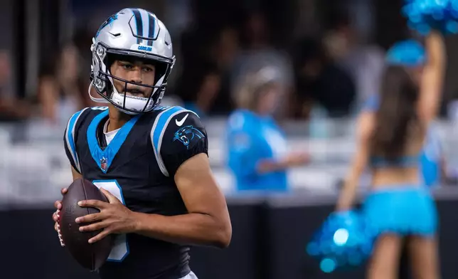 Carolina Panthers quarterback Bryce Young (9) warms up during the NFL football team's fan fest Friday, July 31, 2026, in Charlotte, N.C. (AP Photo/Scott Kinser)